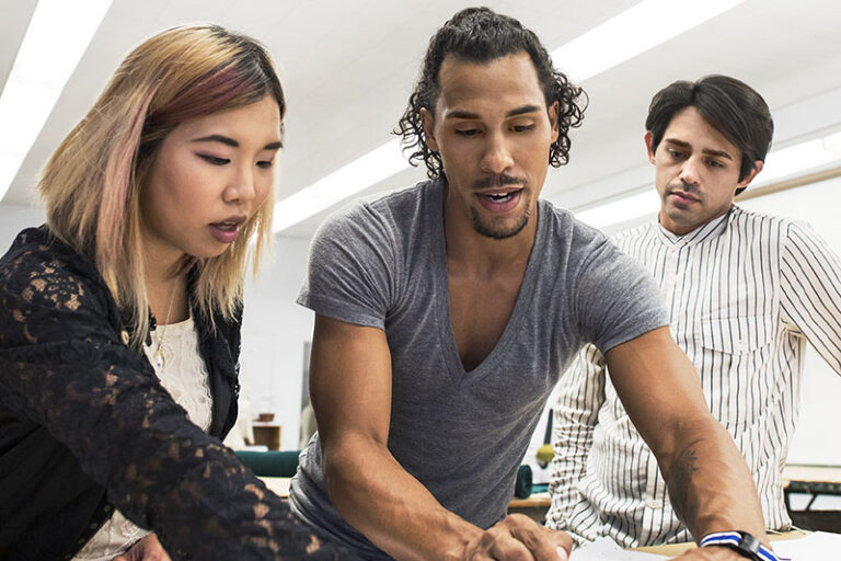 A group of young professionals working on a project together