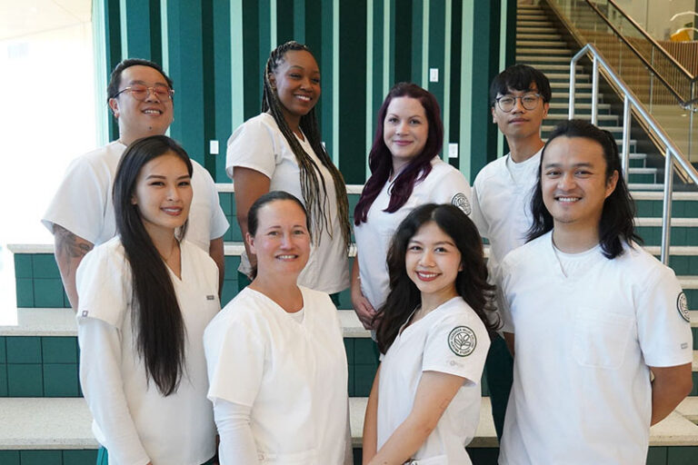 a group of students in the medical sector wearing scrubs